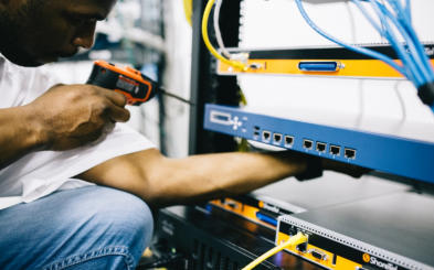 Photo of man using a tool to check some equipment
